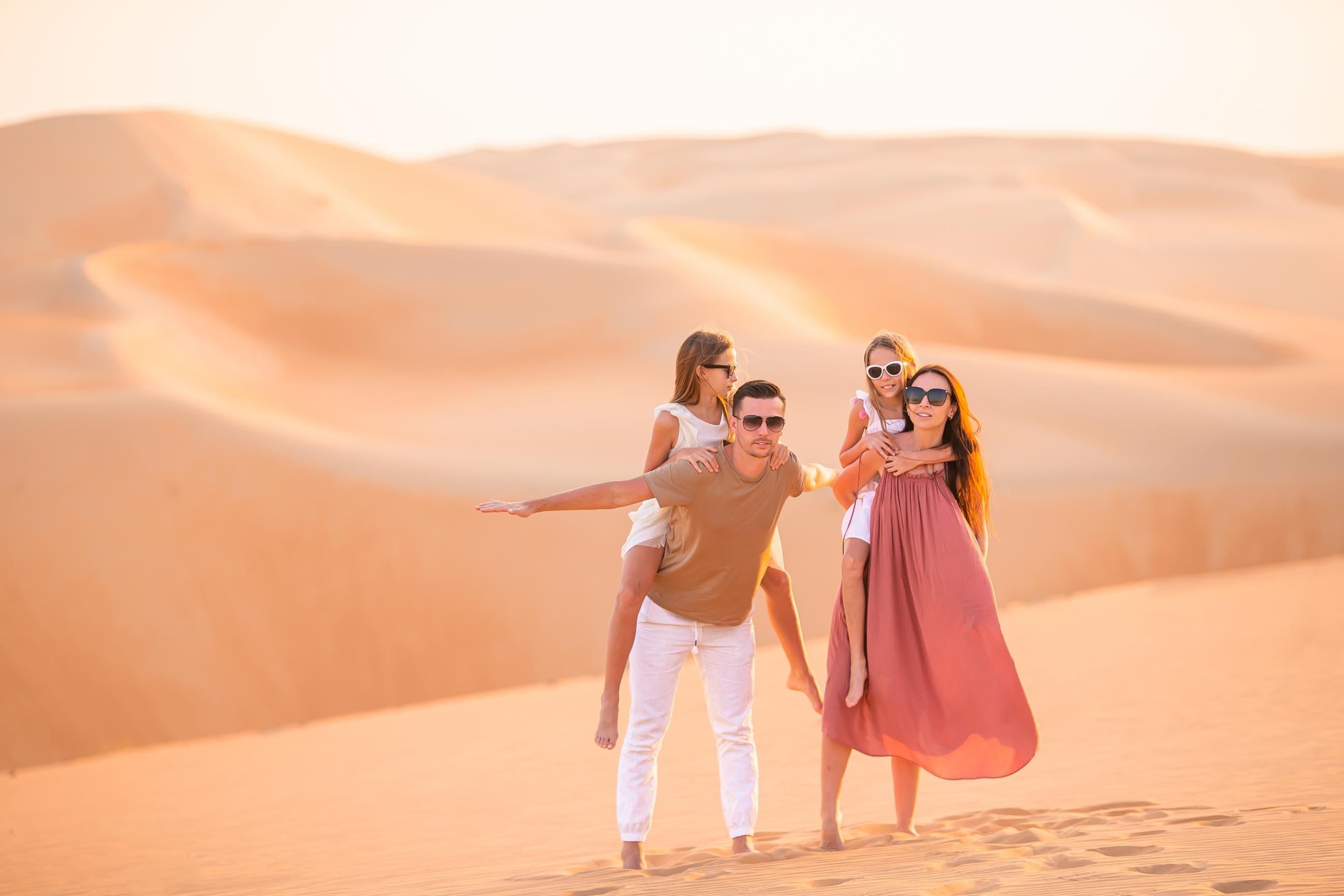 people-among-dunes-in-desert-dubai